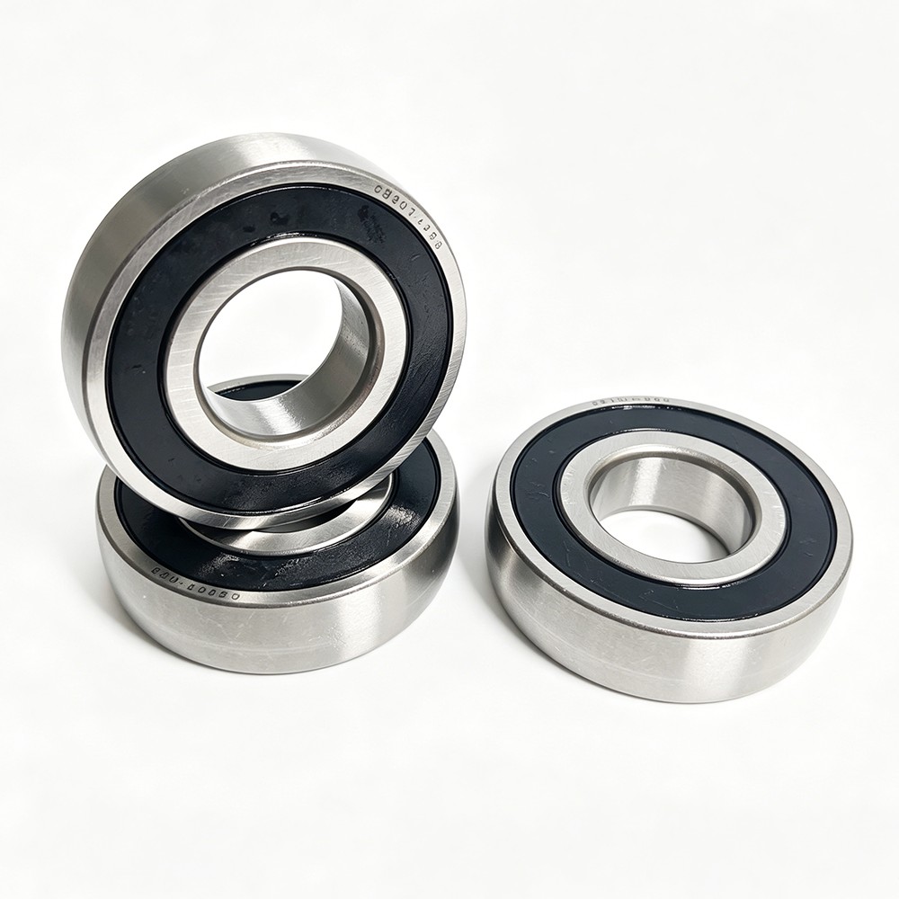 Product Features - Double 2RS rubber seals: dust-proof, waterproof and oil-locking, suitable for harsh working conditions - High-strength bearing steel material: wear-resistant, anti-fatigue and long service life - Low noise and smooth operation: optimized raceway process for stable high-speed operation - Heavy load capacity: suitable for continuous operation and impact load scenarios - Maintenance-free design: long-term grease storage, reduce maintenance frequency Application Scope CB307-2RS track roller bearings are widely applied in automated production lines, cam machinery, linear guide systems, conveyor equipment, packaging machinery, textile machinery and other mechanical transmission fields, providing stable and reliable rolling support for industrial equipment..jpeg Product Features - Double 2RS rubber seals: dust-proof, waterproof and oil-locking, suitable for harsh working conditions - High-strength bearing steel material: wear-resistant, anti-fatigue and long service life - Low noise and smooth operation: optimized raceway process for stable high-speed operation - Heavy load capacity: suitable for continuous operation and impact load scenarios - Maintenance-free design: long-term grease storage, reduce maintenance frequency Application Scope CB307-2RS track roller bearings are widely applied in automated production lines, cam machinery, linear guide systems, conveyor equipment, packaging machinery, textile machinery and other mechanical transmission fields, providing stable and reliable rolling support for industrial equipment..jpeg